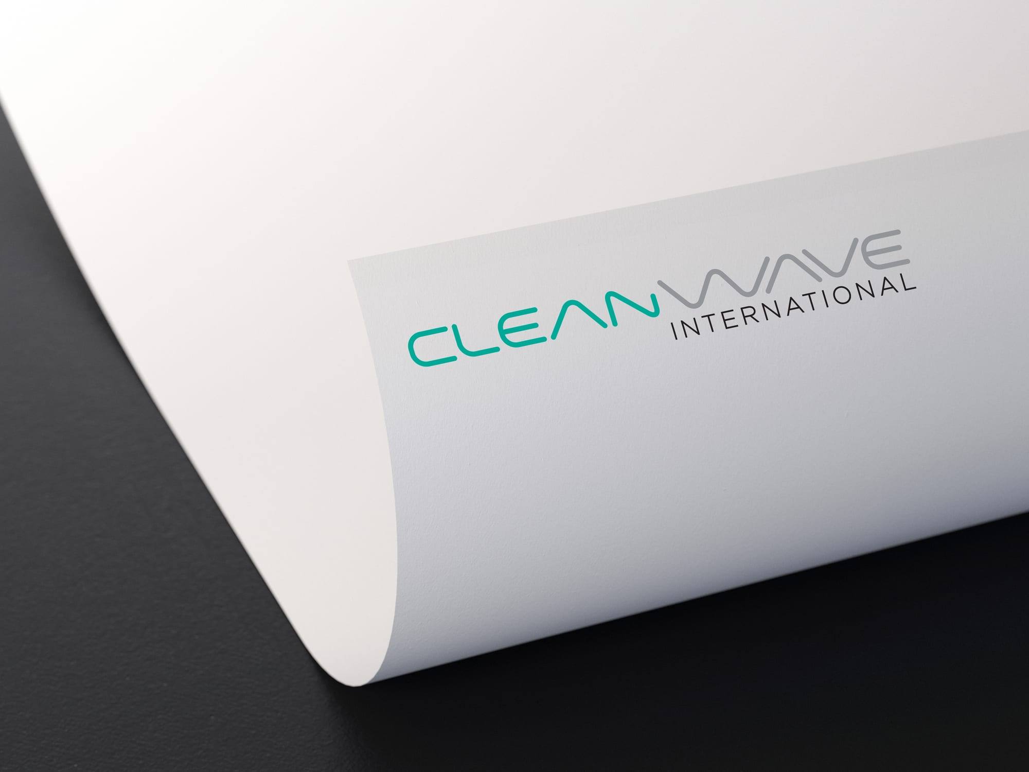Cleanwave International logo in teal and grey on a curled white sheet