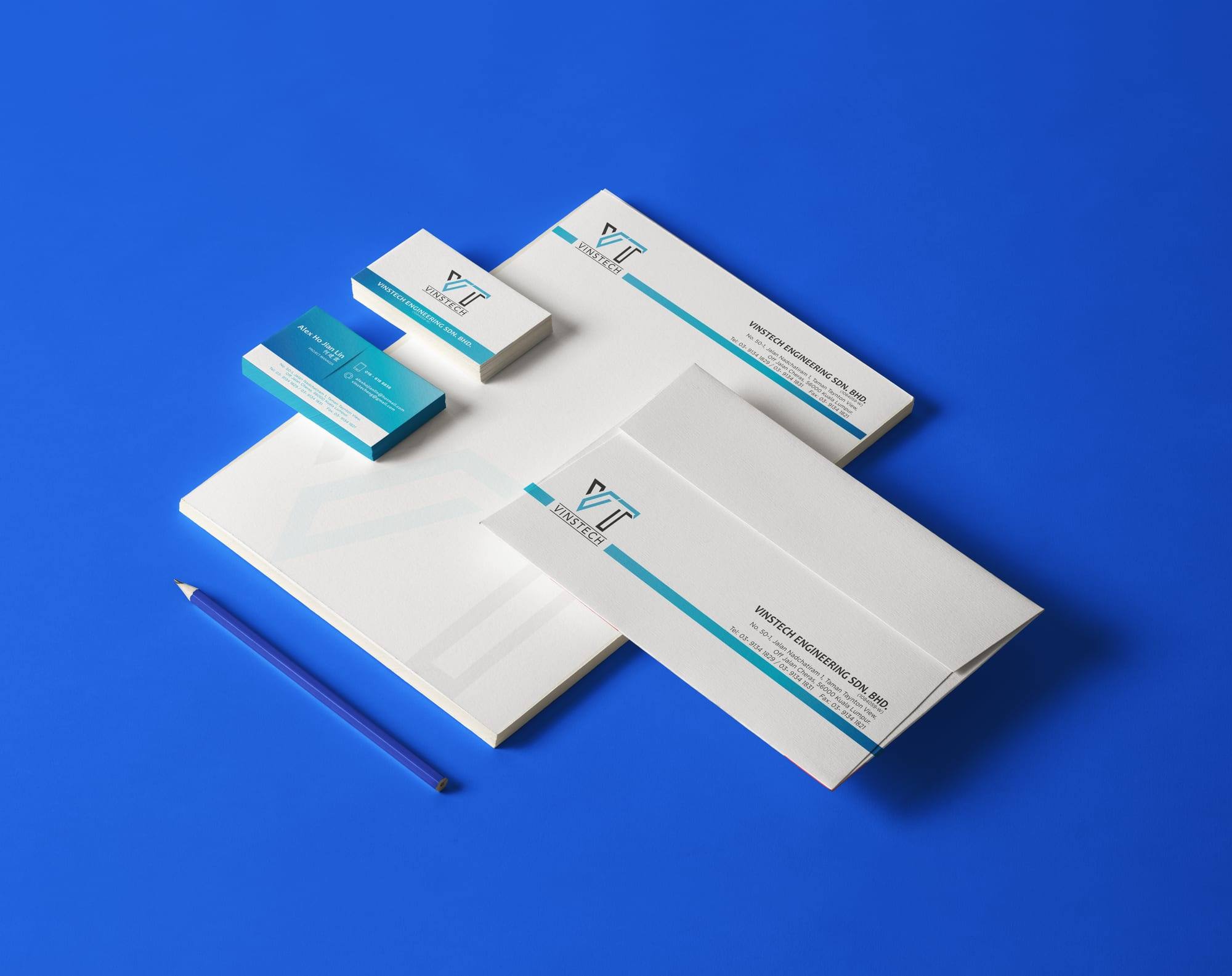 Vinstech Engineering letterhead, envelope and name cards on a bright blue surface